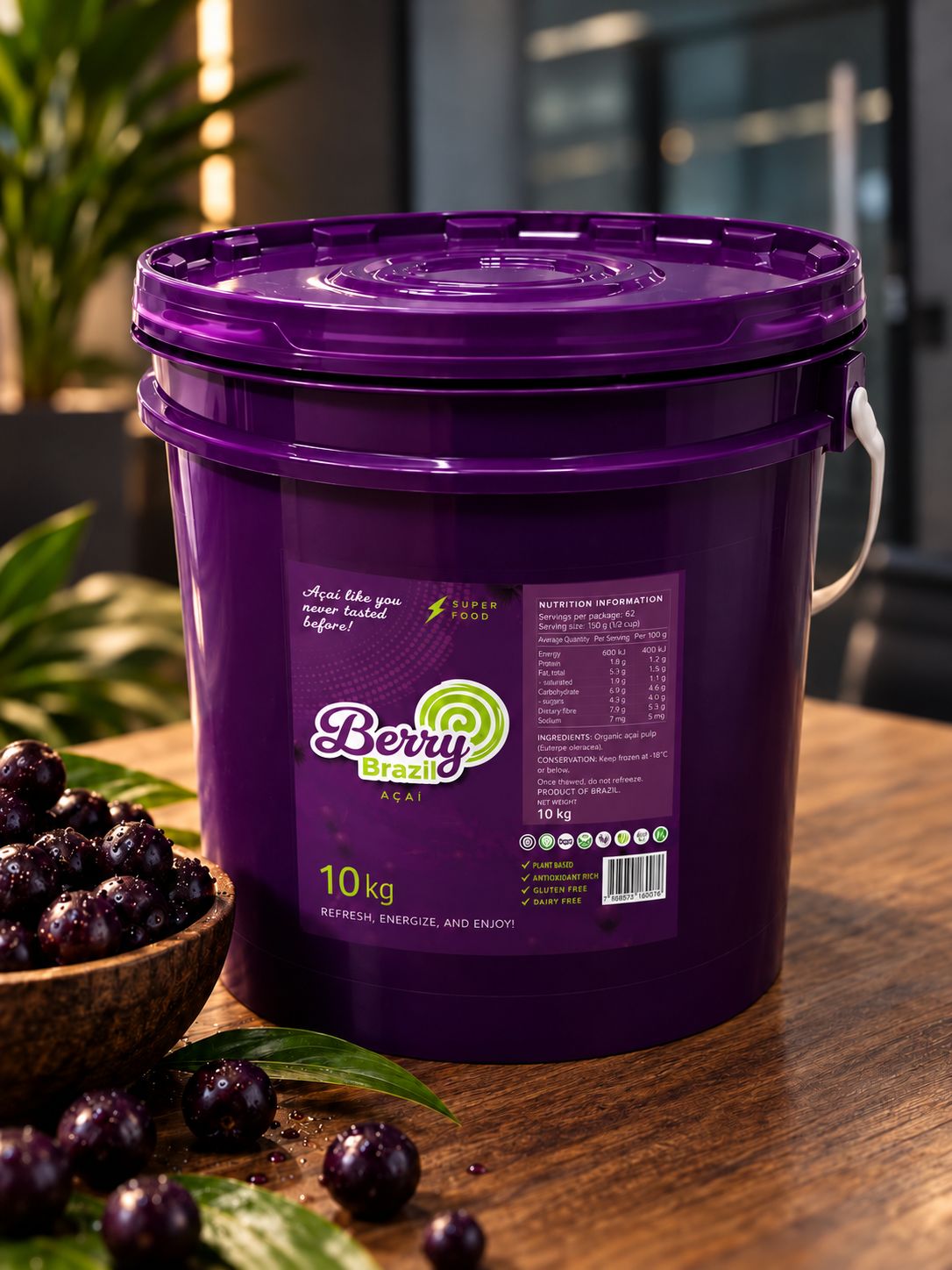 Berry Brazil 10 kg bucket of organic açaí pulp beside fresh açaí berries